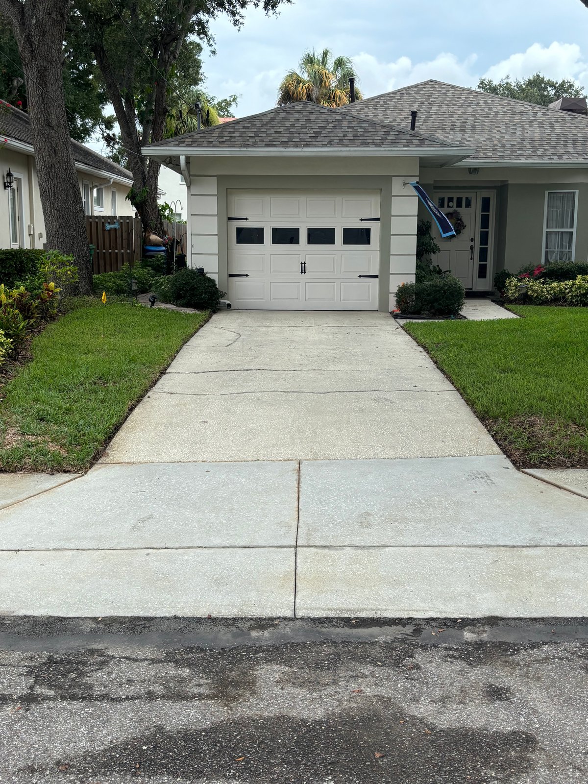Freshly pressure washed concrete driveway at a Tampa home