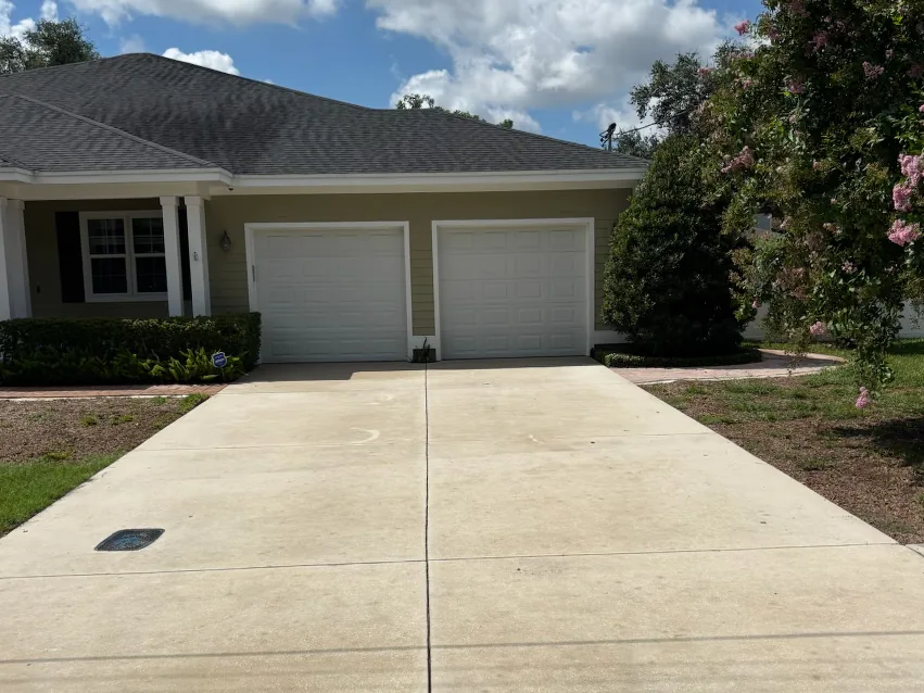 After: cleaned two-car concrete driveway in Tampa